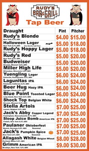 Halloween-themed Rudy’s Bar & Grill Tap Beer Menu featuring cartoon pig mascots in vampire costumes. The menu lists draught beers, including Rudy’s Blonde, Halloween Lager, Rudy’s Hoppy Lager, Rudy’s Red, Budweiser, Miller High Life, Yuengling, Lagunitas IPA, Beer Hug Hazy IPA, Blue Point Toasted Lager, Shock Top Belgian White, Stella Artois, Jack’s Abby Copper Legend, Sloop Juice Bomb, Paulaner Oktoberfest, Jack’s Pumpkin Spice, Allagash White, and Grimm American IPA, with prices for pints and pitchers ran