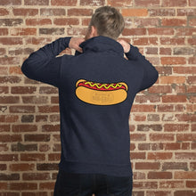 Load image into Gallery viewer, Person wearing Navy blue hoodie featuring a large Rudy’s Bar &amp; Grill hot dog logo on the back, displayed against a reddish-brown textured brick wall background. The hoodie is centered and well-lit, creating a realistic product mockup for Rudy’s Bar &amp; Grill merchandise