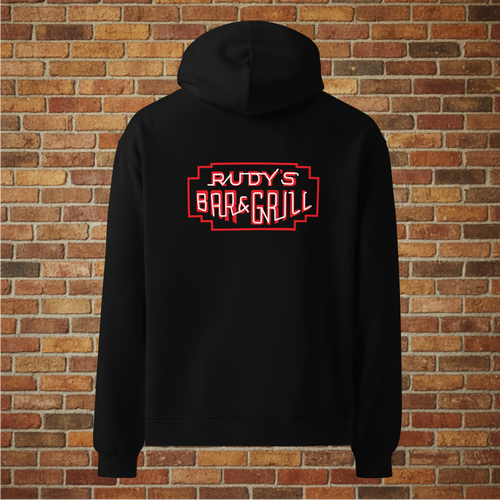 Back view of Rudy’s Bar & Grill Hot Dog Neon Hoodie in black with neon bar sign, displayed against a brick wall background.