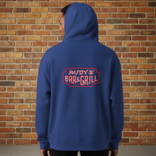 Load image into Gallery viewer, Back view of Rudy’s Bar &amp; Grill Hot Dog Neon Hoodie in cobalt blue, worn by a model, showing the neon bar sign graphic against a brick wall background.