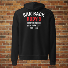 Load image into Gallery viewer, Back view of Rudy’s Bar Back Hoodie in black, featuring “BAR BACK RUDY’S HELL’S KITCHEN NEW YORK CITY EST. 1933” text, displayed on a brick wall background