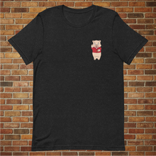 Load image into Gallery viewer, Front of Rudy’s Bar &amp; Grill Bar Back T-Shirt featuring the Baron Von Swine mascot, displayed against a brick wall background