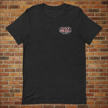 Load image into Gallery viewer, Classic Rudy’s Bar &amp; Grill black t-shirt laid flat, front view with small logo, brick wall background