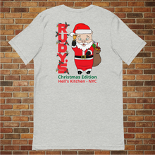 Load image into Gallery viewer, Back of Rudy&#39;s Bar &amp; Grill classic Christmas T-shirt at an angle with Baron Von Swine Santa design and Hell&#39;s Kitchen NYC text