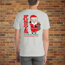 Load image into Gallery viewer, Back of Rudy&#39;s Bar &amp; Grill classic Christmas T-shirt on man with Baron Von Swine Santa design and Hell&#39;s Kitchen NYC text