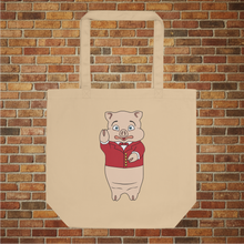 Load image into Gallery viewer, Rudy’s Bar &amp; Grill Classic Pig Eco Tote Bag with Baron Von Swine mascot, closeup product mockup on brick wall background