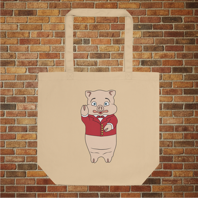 Rudy’s Bar & Grill Classic Pig Eco Tote Bag with Baron Von Swine mascot, closeup product mockup on brick wall background