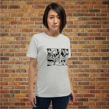 Load image into Gallery viewer, Female model wearing Rudy’s Bar &amp; Grill Danny the Bartender t-shirt in athletic heather, displaying a cartoon bartender illustration on the chest