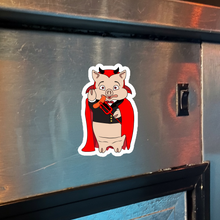 Load image into Gallery viewer, Baron Von Swine devil magnet from Rudy’s Bar &amp; Grill displayed on a metal surface for Halloween 2025 – NYC bar merchandise
