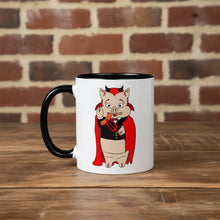 Load image into Gallery viewer, Rudy’s Bar &amp; Grill Halloween coffee mug featuring the devil pig cartoon design, placed on a rustic wood bar with a brick wall background