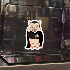 Baron Von Swine Dracula magnet from Rudy’s Bar & Grill displayed on a metal surface – Halloween 2025 NYC bar merchandise collectible