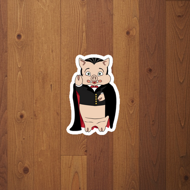 Baron Von Swine Dracula magnet from Rudy’s Bar & Grill on rustic wood background – Halloween 2025 NYC bar collectible magnet