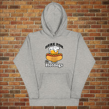 Load image into Gallery viewer, Rudy’s Bar &amp; Grill “Here For the Hotdogs” hoodie in carbon grey, front view, featuring beer and hot dog graphic with Rudy’s logo, flat lay on brick wall background.