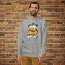 Load image into Gallery viewer, Smiling man wearing Rudy’s Bar &amp; Grill “Here For the Hotdogs” hoodie in carbon grey, front view, with beer and hot dog graphic, standing in front of a brick wall.