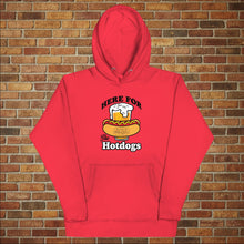 Load image into Gallery viewer, Rudy’s Bar &amp; Grill “Here For the Hotdogs” hoodie in red, front view, featuring beer and hot dog graphic with Rudy’s logo, flat lay on brick wall background.