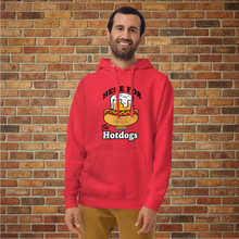 Load image into Gallery viewer, Smiling man wearing Rudy’s Bar &amp; Grill “Here For the Hotdogs” hoodie in red, front view, with beer and hot dog graphic, standing in front of a brick wall.
