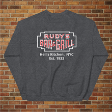 Load image into Gallery viewer, Flat lay back view of Rudy’s Bar &amp; Grill Neon Sign sweatshirt in dark heather, displaying the bar’s neon sign logo with Hell’s Kitchen, NYC, Est. 1933