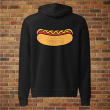 Load image into Gallery viewer, Back view of Rudy’s Bar &amp; Grill unisex black hoodie featuring a large hot dog graphic with the bar’s logo inside the bun