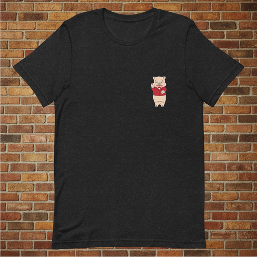 Front view of a black heather t-shirt with a small Baron Von Swine pig logo on the chest, modeled in front of a brick wall.