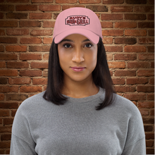 Load image into Gallery viewer, Model wearing Rudy’s Bar &amp; Grill pink dad hat with neon sign logo, NYC bar merch, Valentine’s Day