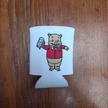 Load image into Gallery viewer, Flat lay of Rudy’s Bar &amp; Grill retro pig can koozie featuring Baron Von Swine mascot in a red jacket, on rustic wood surface
