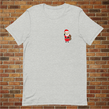 Load image into Gallery viewer, Front of Rudy’s Bar &amp; Grill Santa Pig Christmas T-Shirt – Baron Von Swine in Santa suit, flat lay, NYC bar holiday shirt on brick wall background
