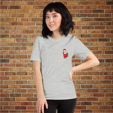 Load image into Gallery viewer, Front of Rudy’s Bar &amp; Grill Santa Pig Christmas T-Shirt – Baron Von Swine in Santa suit, Hell’s Kitchen NYC, brick wall background