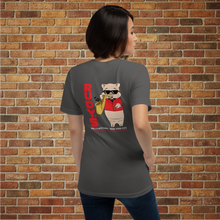 Load image into Gallery viewer, Person showing the back of Rudy’s Bar &amp; Grill Saxophone Pig T-shirt in asphalt gray, featuring cartoon pig playing saxophone, brick wall background.