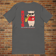 Load image into Gallery viewer, Rudy’s Bar &amp; Grill Saxophone Pig T-shirt in asphalt gray, back view, flat lay on brick wall background, featuring cartoon pig playing saxophone with Rudy’s branding.
