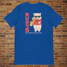 Load image into Gallery viewer, Rudy’s Bar &amp; Grill Saxophone Pig T-shirt in true royal blue, back view, flat lay on brick wall background, featuring cartoon pig playing saxophone with Rudy’s branding.