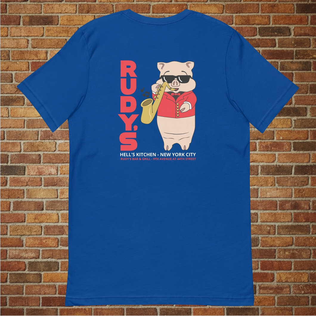Rudy’s Bar & Grill Saxophone Pig T-shirt in true royal blue, back view, flat lay on brick wall background, featuring cartoon pig playing saxophone with Rudy’s branding.