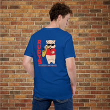 Load image into Gallery viewer, Person showing the back of Rudy’s Bar &amp; Grill Saxophone Pig T-shirt in true royal blue, featuring cartoon pig playing saxophone, brick wall background.