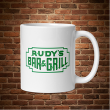 Load image into Gallery viewer, Rudy’s Bar &amp; Grill St. Patrick’s Day mug, handle on right side