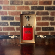 Load image into Gallery viewer, Rudy’s Bar &amp; Grill red Yeti flask and metal funnel in an open gift box, displayed on a bar with a brick wall background