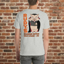 Load image into Gallery viewer, Rudy’s Bar &amp; Grill Halloween edition t-shirt with vampire pig graphic shown on model, brick wall background