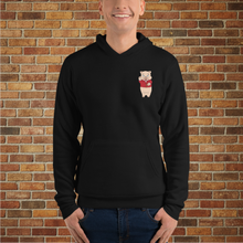 Load image into Gallery viewer, Front view of Rudy’s Bar &amp; Grill Baron Von Swine Neon Sign Hoodie worn by a model – black pullover with small Baron Von Swine pig mascot graphic on the chest, displayed against a brick wall background
