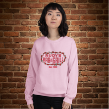 Load image into Gallery viewer, Person wearing light pink Rudy’s Bar &amp; Grill neon sign Valentine’s Day sweatshirt in front of brick wall