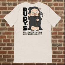 Load image into Gallery viewer, Back view of Rudy’s Bar &amp; Grill Halloween Edition heather dust t-shirt featuring Baron Von Swine dressed as the Grim Reaper with vertical &quot;RUDY’S&quot; text and &quot;Halloween Edition Hell’s Kitchen - NYC&quot; below, displayed on a brick wall background