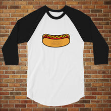 Load image into Gallery viewer, Rudy’s Bar &amp; Grill Hot Dog 3/4 Sleeve Baseball Shirt in white with black sleeves, featuring a hot dog graphic, displayed flat against a brick wall background