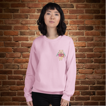 Load image into Gallery viewer, Person wearing a light pink crew neck sweatshirt with Baron Von Swine holding a heart on the front, standing in front of a brick wall at Rudy’s Bar &amp; Grill