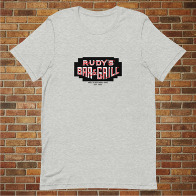 Rudy’s Bar & Grill Neon Sign T-Shirt in athletic heather displayed flat against a brick wall background