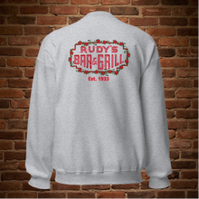 Load image into Gallery viewer, Sport grey crew neck sweatshirt with Rudy’s Bar &amp; Grill neon sign and “Est. 1933” on the back, displayed flat against a brick wall background