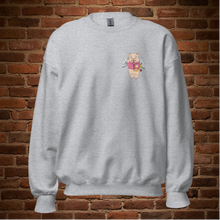 Load image into Gallery viewer,  Sport grey crew neck sweatshirt with Baron Von Swine holding a heart on the front, displayed flat against a brick wall background