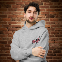 Load image into Gallery viewer, Man wearing Rudy’s Bar &amp; Grill Valentine’s Day NYC Edition oversized hoodie, front view – script Rudy’s logo on athletic heather gray, brick wall background