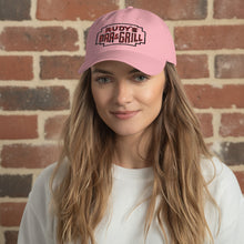 Load image into Gallery viewer, Woman wearing Rudy’s Bar &amp; Grill pink dad hat, classic NYC dive bar merch, Valentine’s Day style