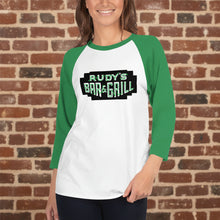 Load image into Gallery viewer, Front mockup of Rudy’s Bar &amp; Grill St. Paddy’s Day 3/4 sleeve raglan shirt in white and green