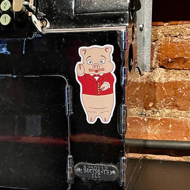 Baron Von Swine pig magnet from Rudy’s Bar & Grill on a register, NYC bar souvenir