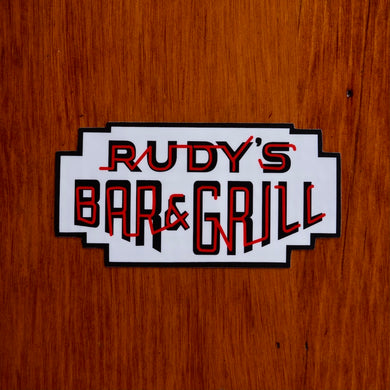 Rudy’s Bar & Grill neon sign logo sticker on wood background in Hell’s Kitchen bar