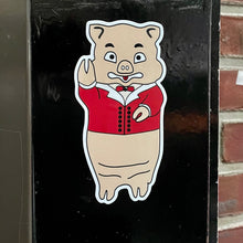 Load image into Gallery viewer, Vintage Baron Von Swine pig sticker from Rudy’s Bar &amp; Grill on black metal surface, NYC bar merch