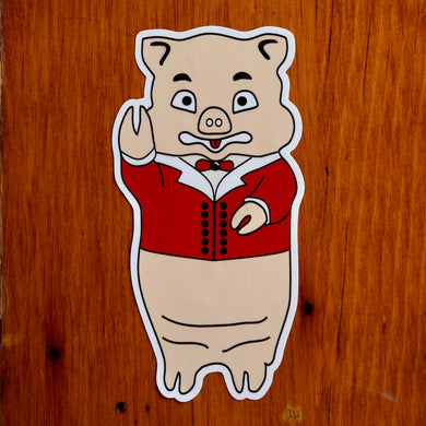 Vintage Baron Von Swine pig sticker from Rudy’s Bar & Grill on wood background, classic NYC bar souvenir